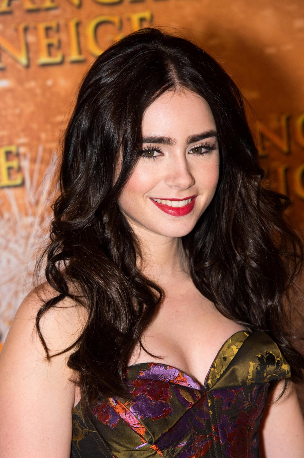 Lily Collins braless in the strapless dres at Mirror Mirror premiere in Paris #75268072