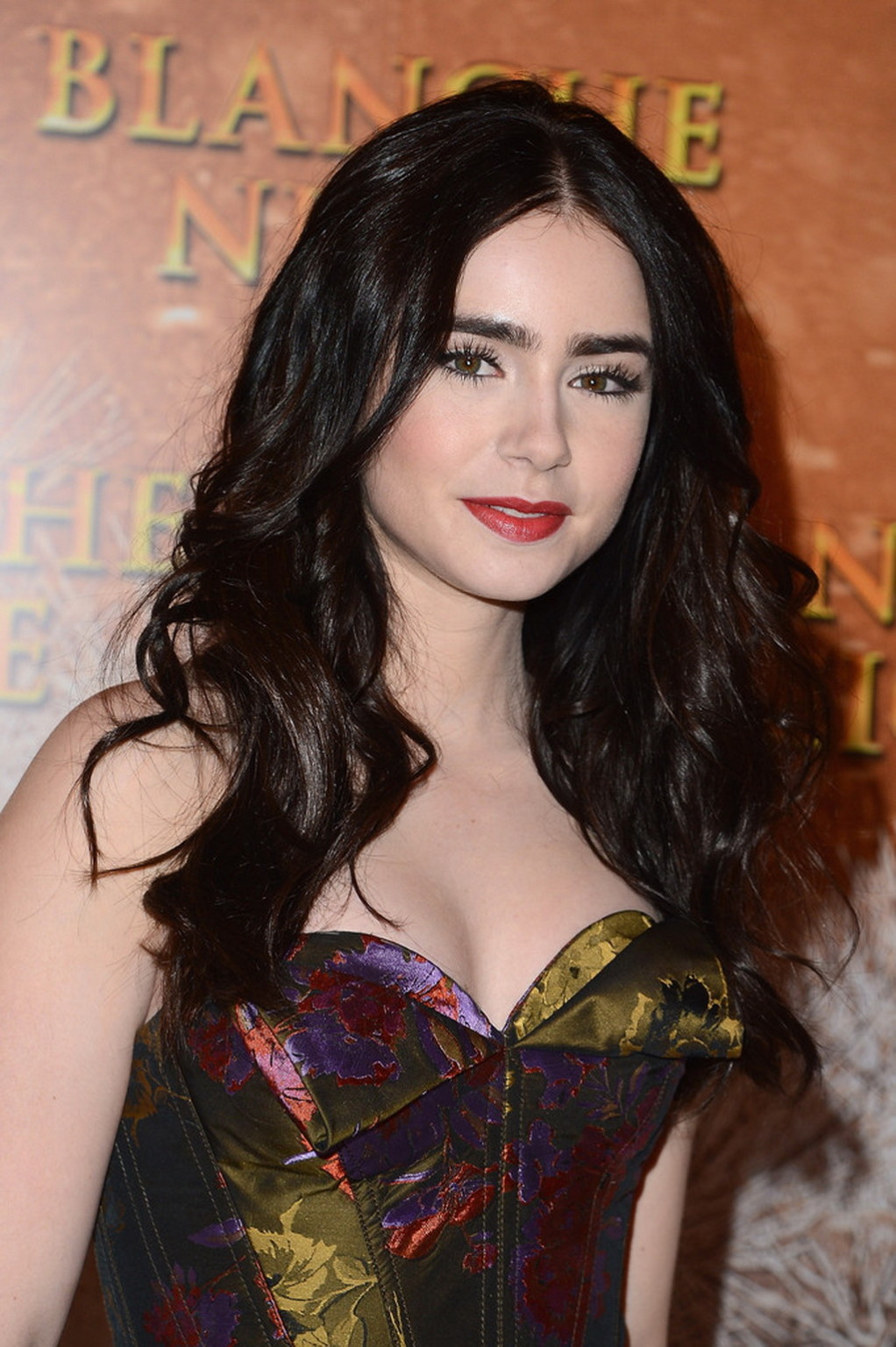 Lily Collins braless in the strapless dres at Mirror Mirror premiere in Paris #75268080