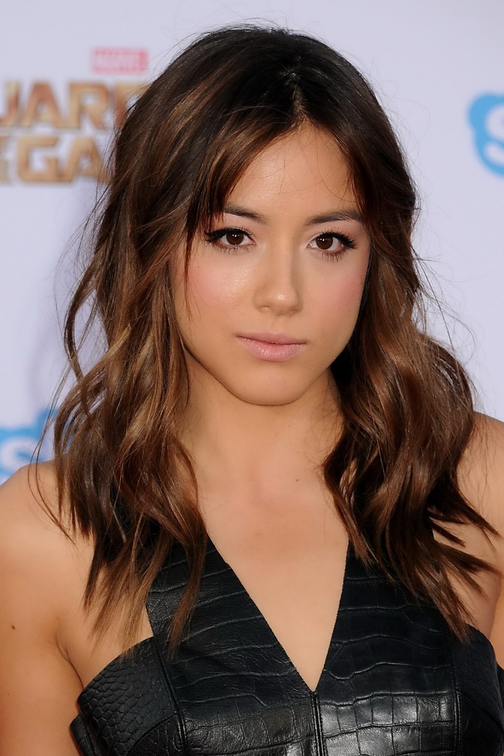 Chloe Bennet busty in black leather belly top and skirt at the Guardians Of The  #75189966