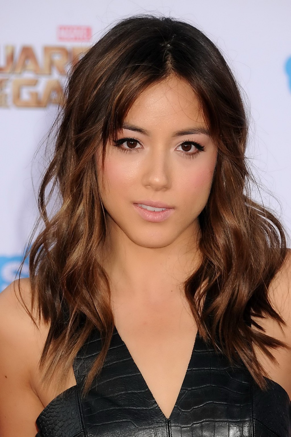 Chloe Bennet busty in black leather belly top and skirt at the Guardians Of The  #75189975