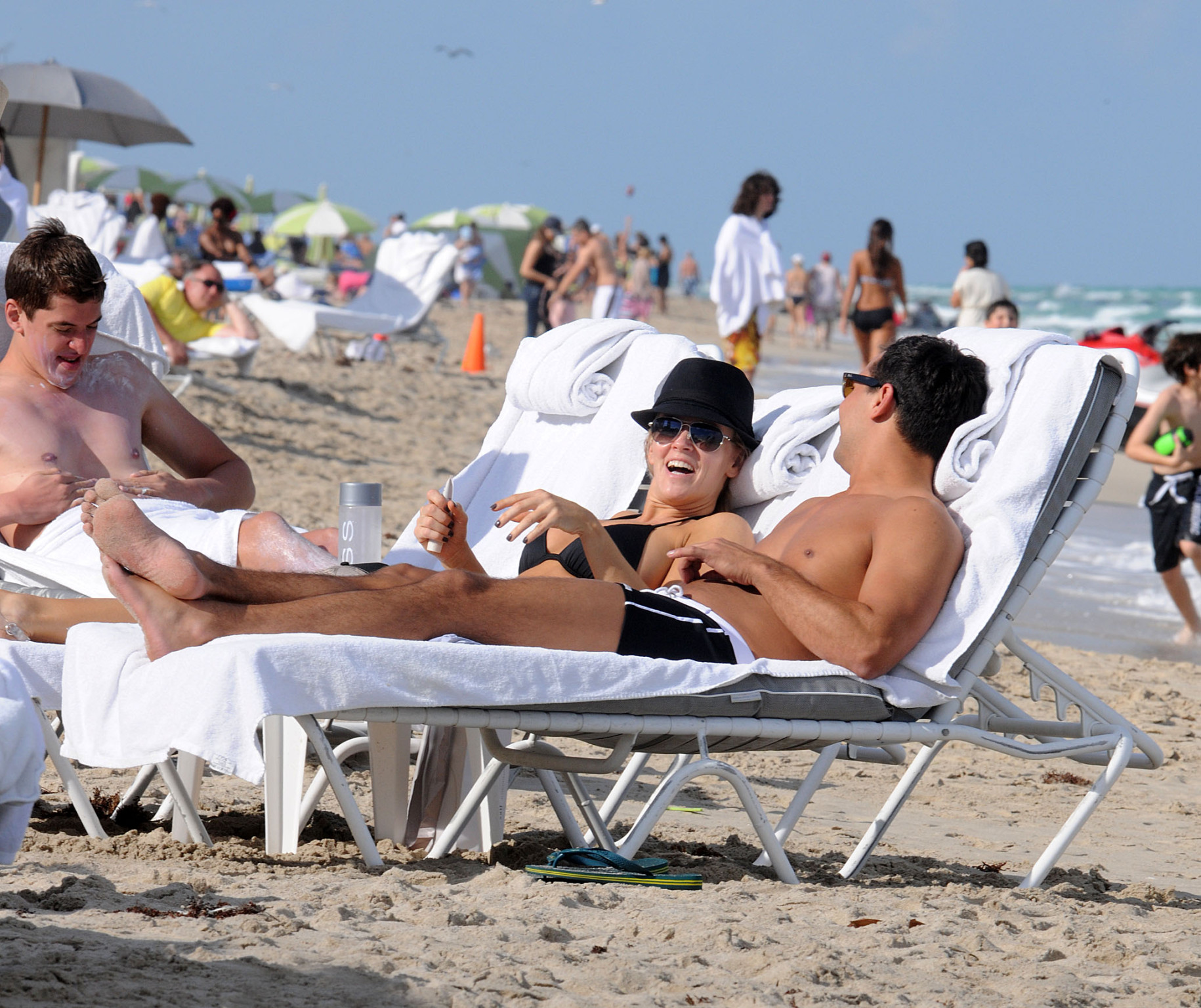 Jenny McCarthy busty wearing skimpy black bikini on a beach in Miami #75313489