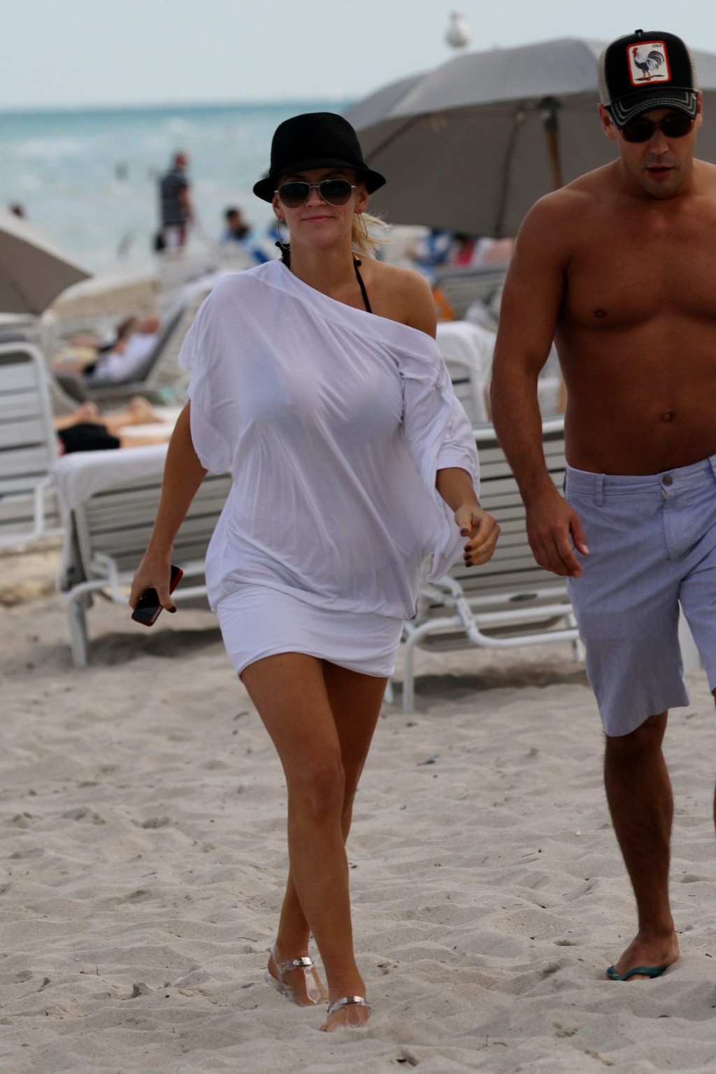 Jenny McCarthy busty wearing skimpy black bikini on a beach in Miami #75313604