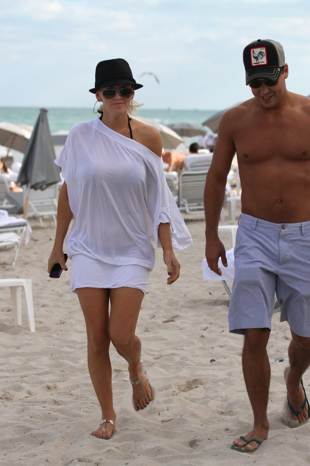 Jenny McCarthy busty wearing skimpy black bikini on a beach in Miami #75313610