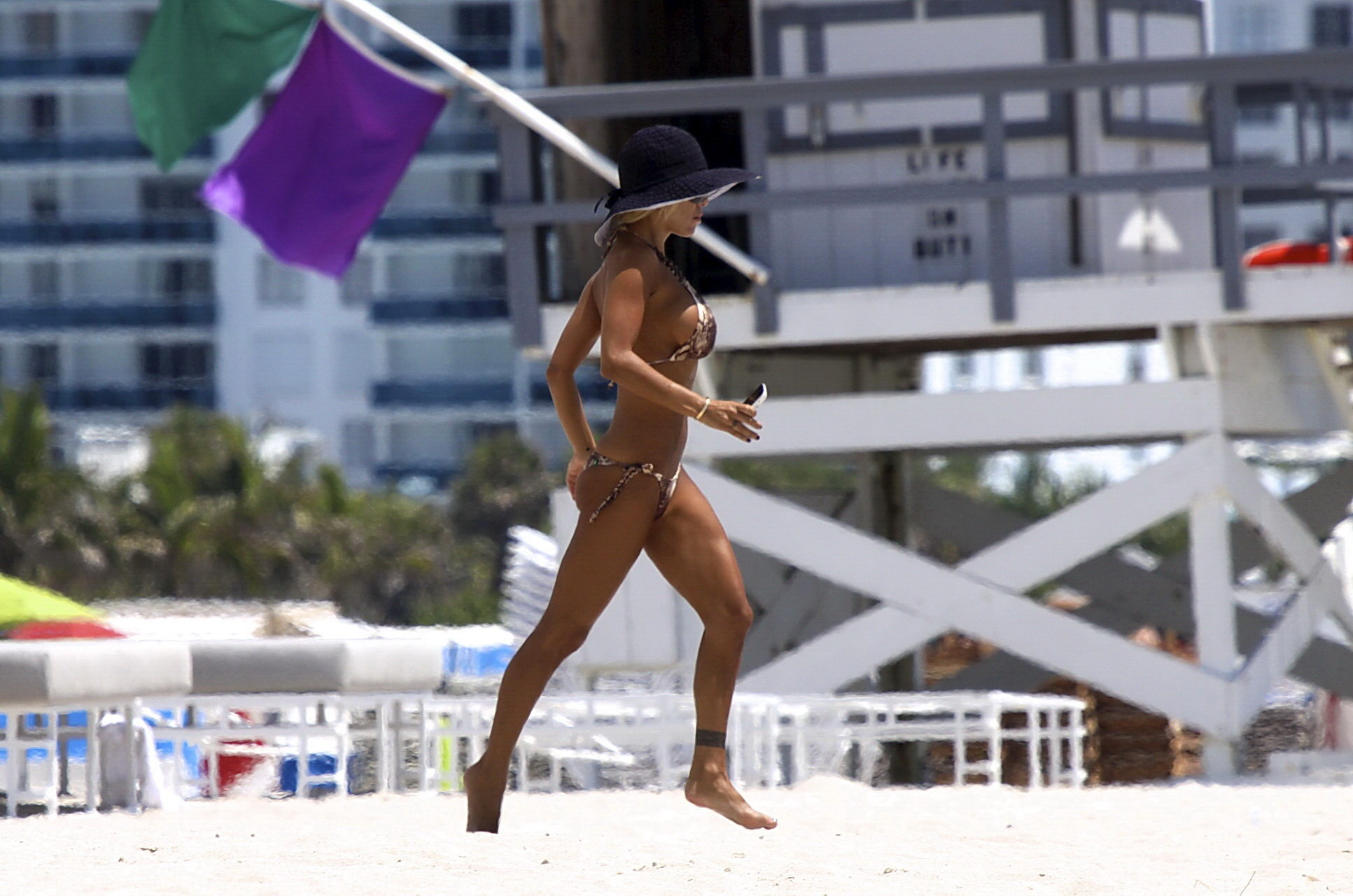 Busty Shauna Sand wearing skimpy bikini on the beach in Miami #75341634