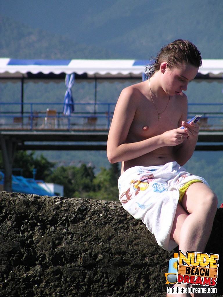 Teen girl caught topless at the public beach #67307157