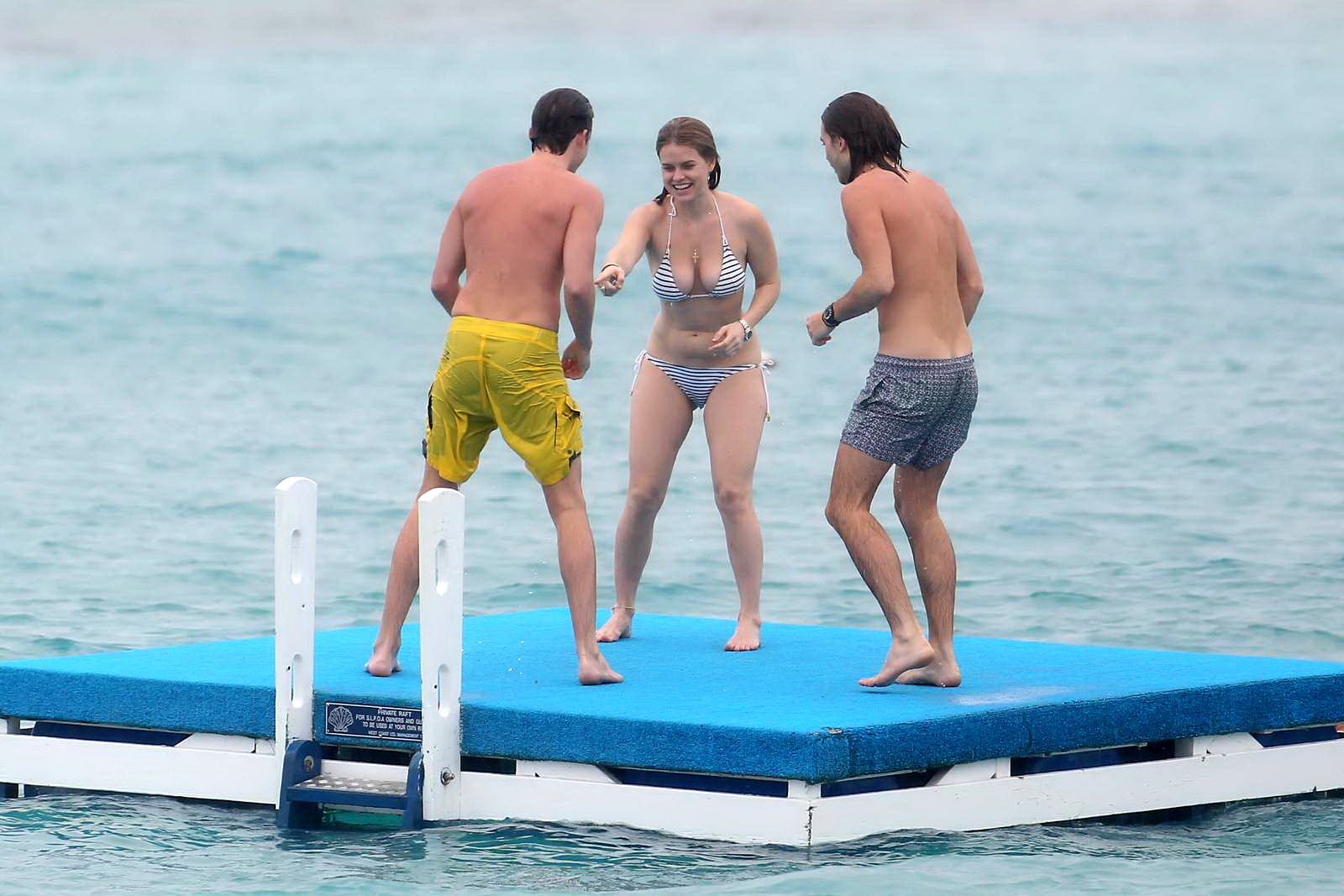 Alice Eve slipping out of her skimpy striped bikini on a beach in Barbados #75208975