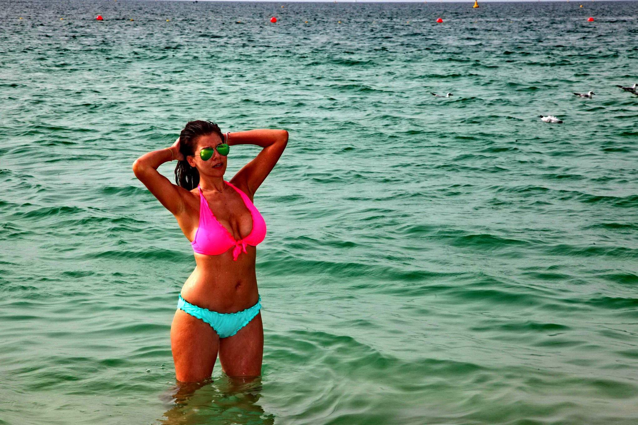 Busty Imogen Thomas wearing a two color bikini on a beach in Dubai #75204758