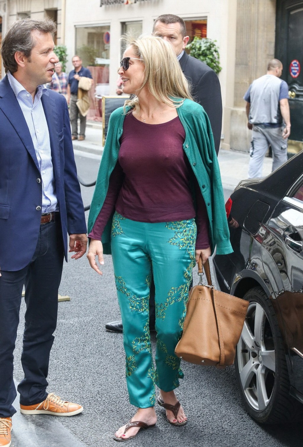 Sharon Stone showing off her huge boobs in a purple see-through top out in Paris #75225729