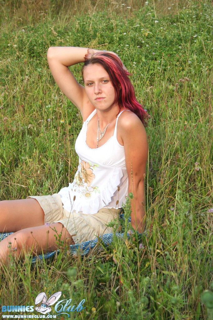 Cute redhead girl in the grass #68260262