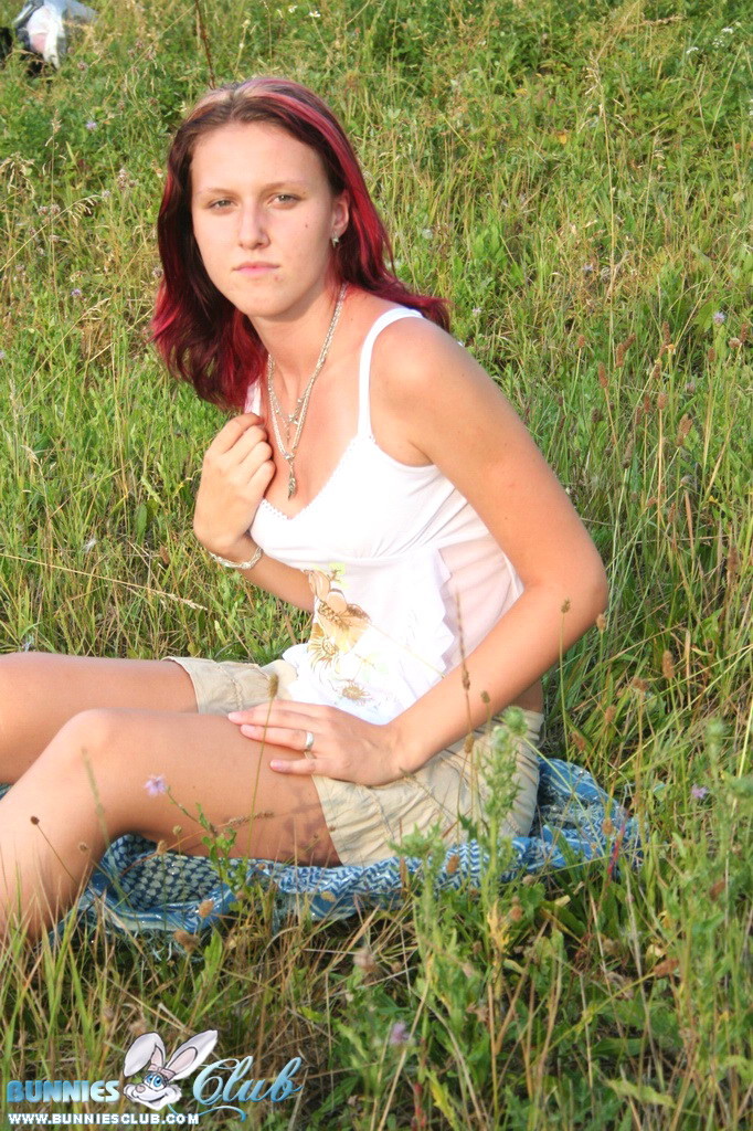 Cute redhead girl in the grass #68260273