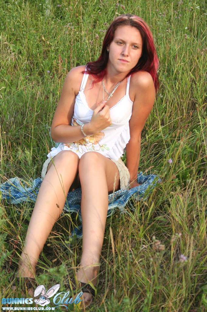 Cute redhead girl in the grass #68260292