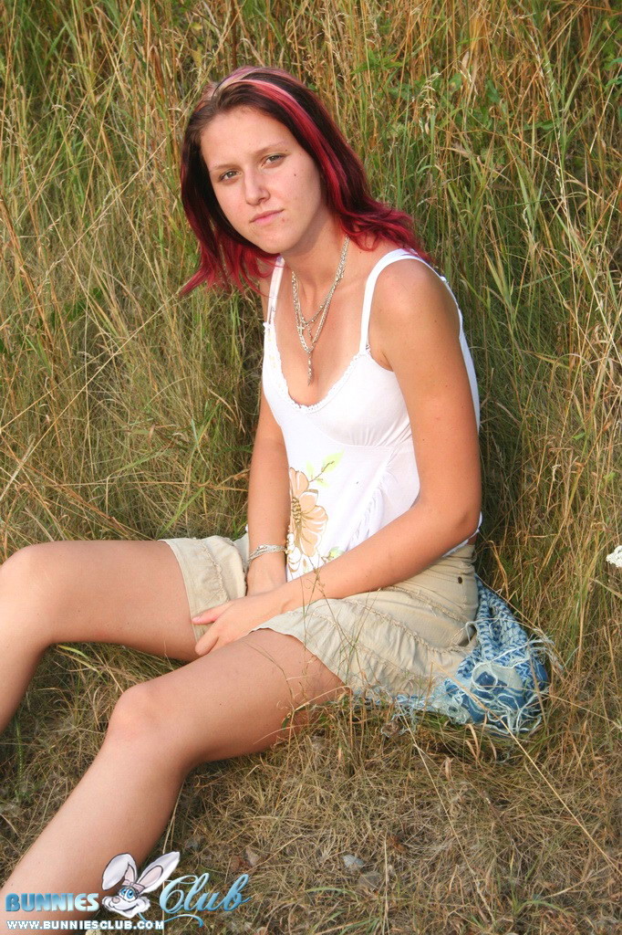 Cute redhead girl in the grass #68260315