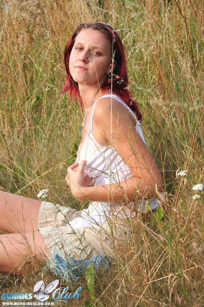 Cute redhead girl in the grass #68260323