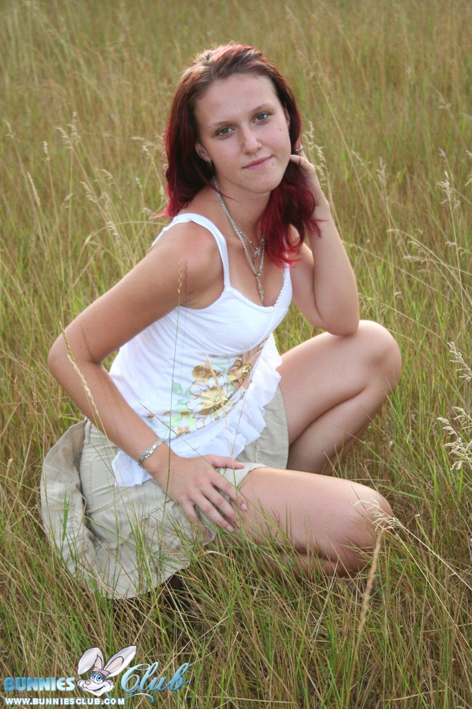 Cute redhead girl in the grass #68260352