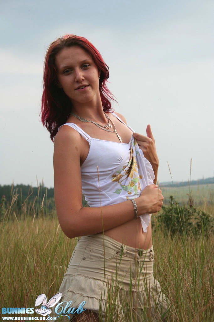 Cute redhead girl in the grass #68260398