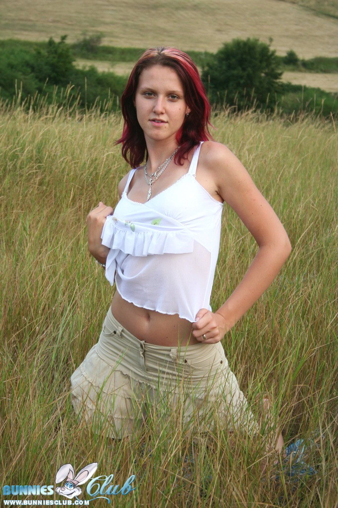 Cute redhead girl in the grass #68260407