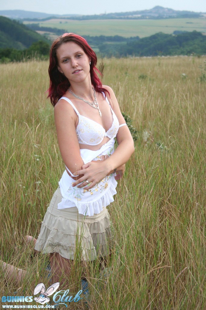 Cute redhead girl in the grass #68260434