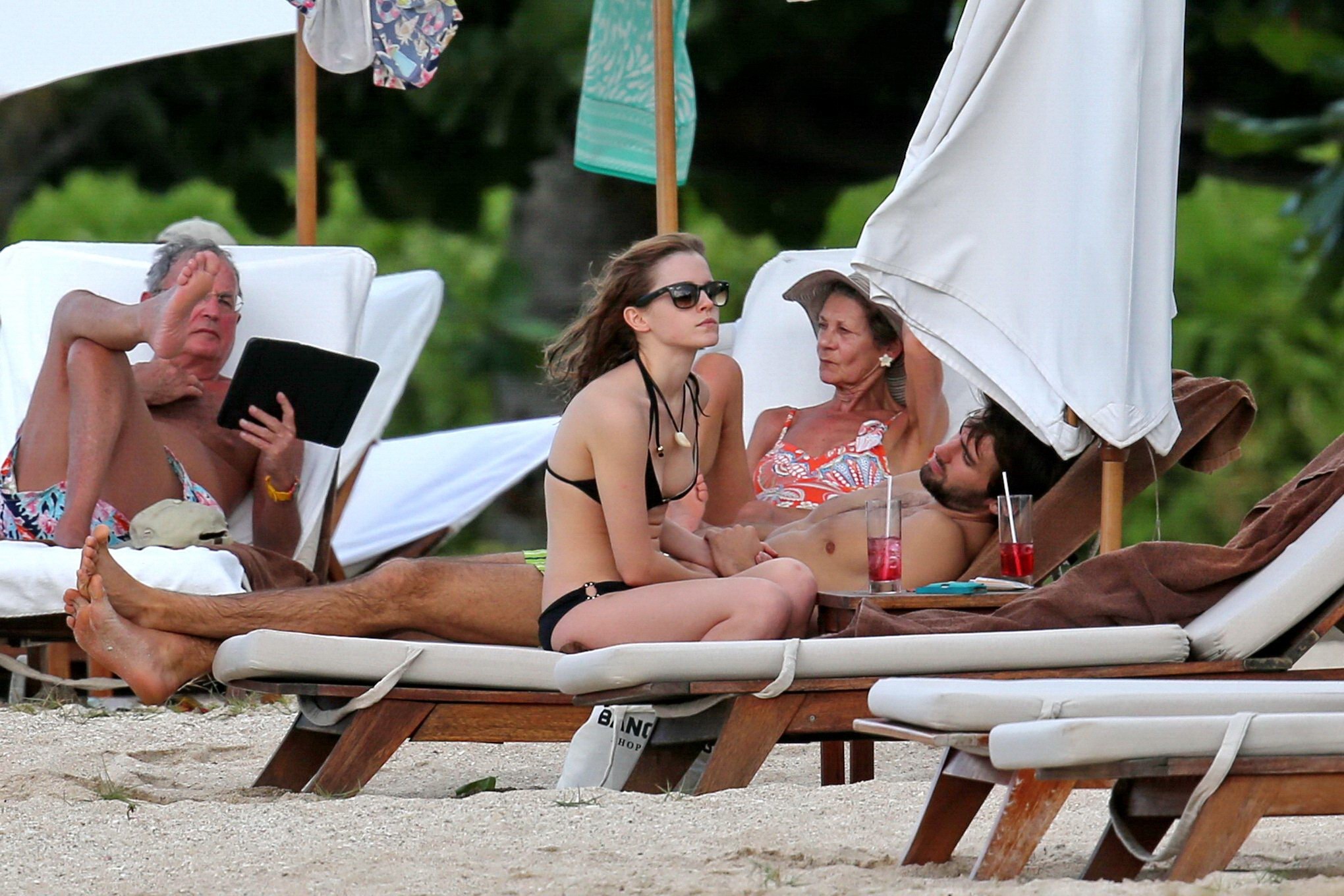 Emma Watson In Black Bikini Petting With Her Boyfriend On A Carribean Beach