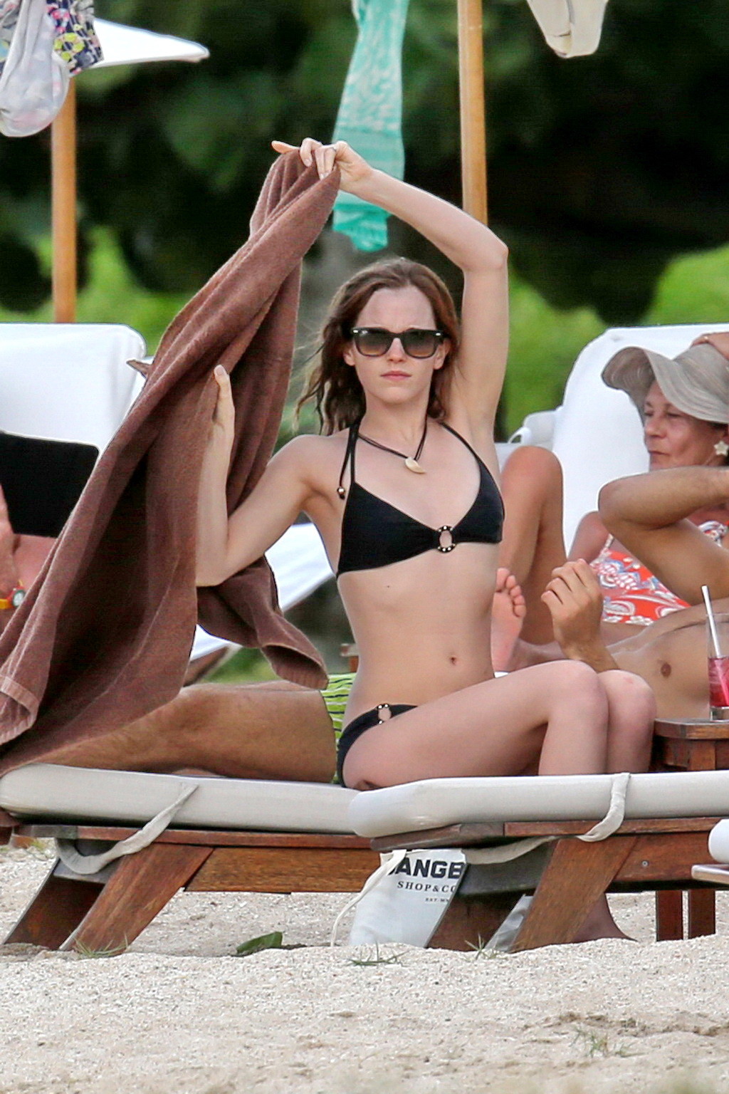 Emma Watson in black bikini petting with her boyfriend on a Carribean beach #75207794