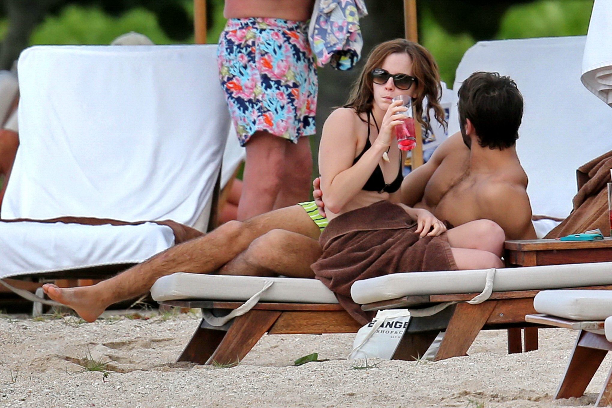 Emma Watson in black bikini petting with her boyfriend on a Carribean beach #75207805