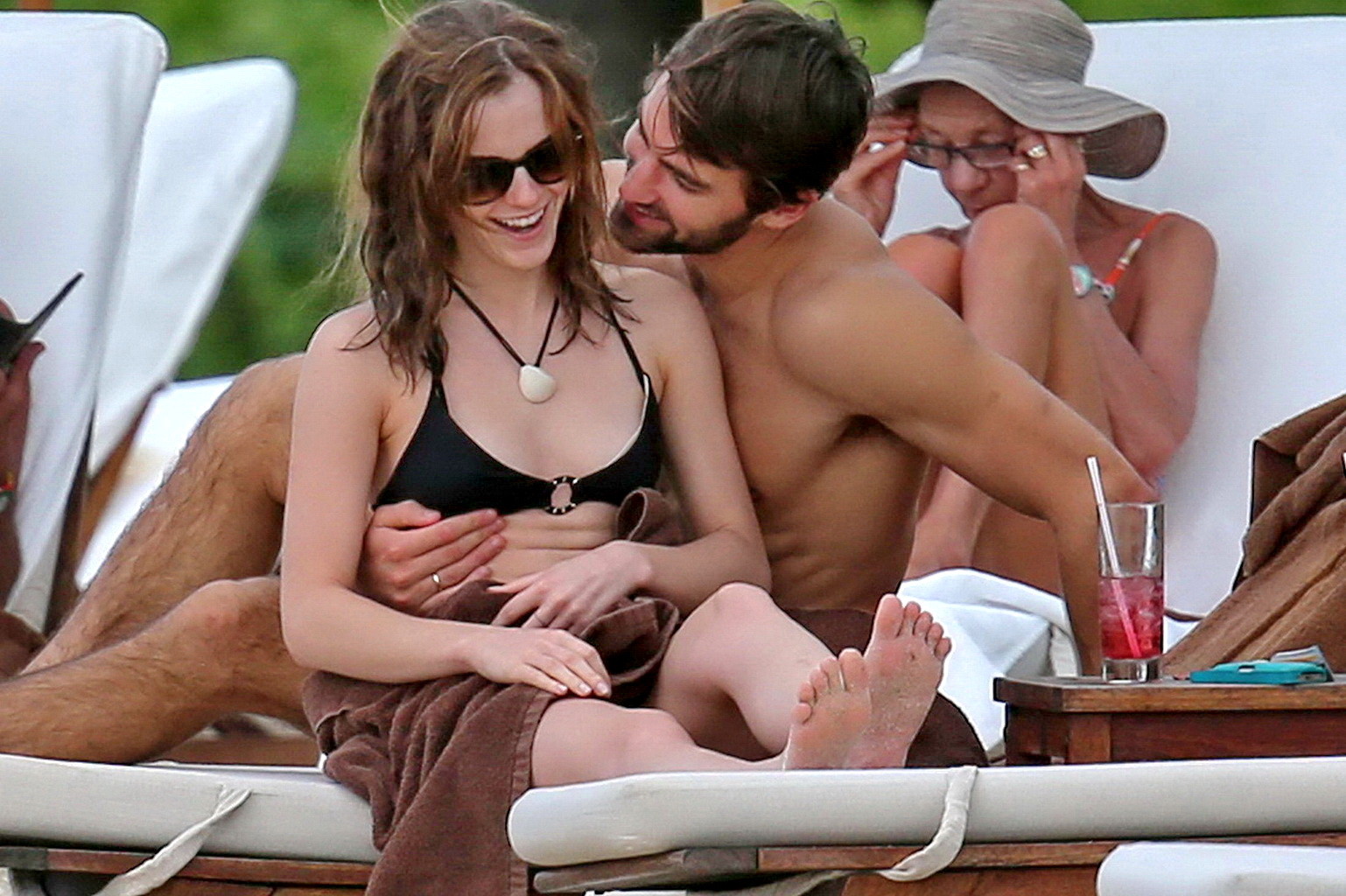 Emma Watson in black bikini petting with her boyfriend on a Carribean beach #75207814