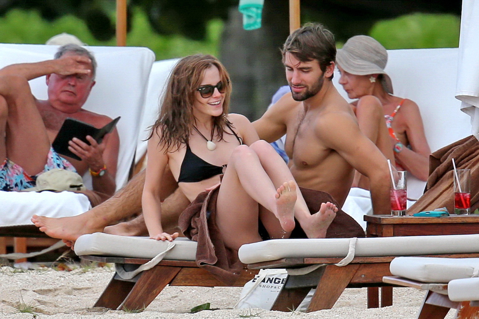 Emma Watson in black bikini petting with her boyfriend on a Carribean beach #75207821