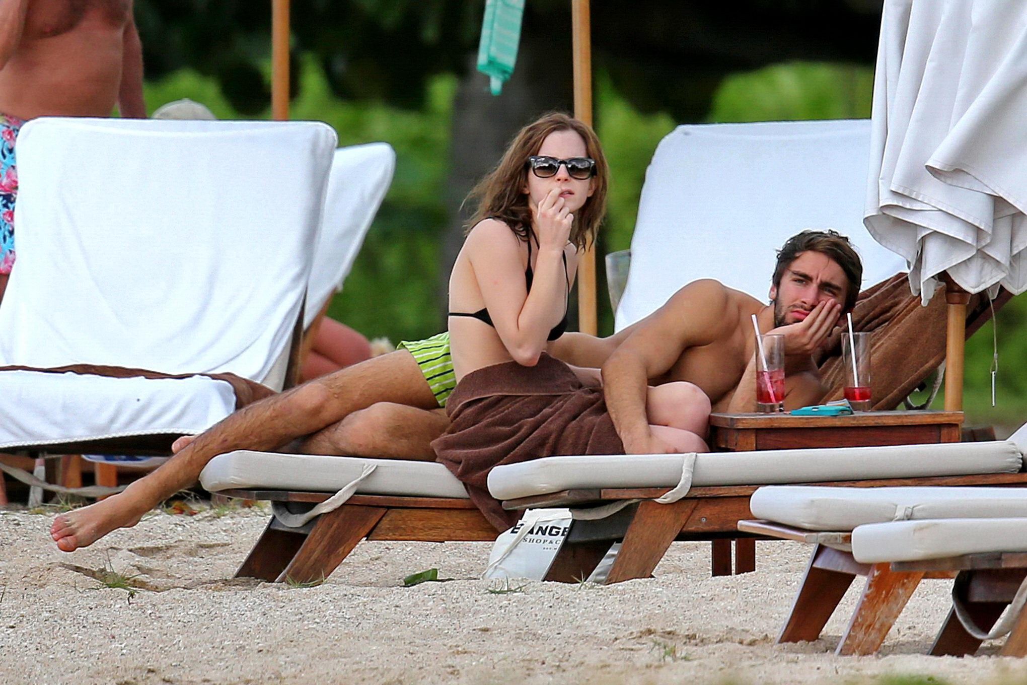 Emma Watson in black bikini petting with her boyfriend on a Carribean beach #75207827