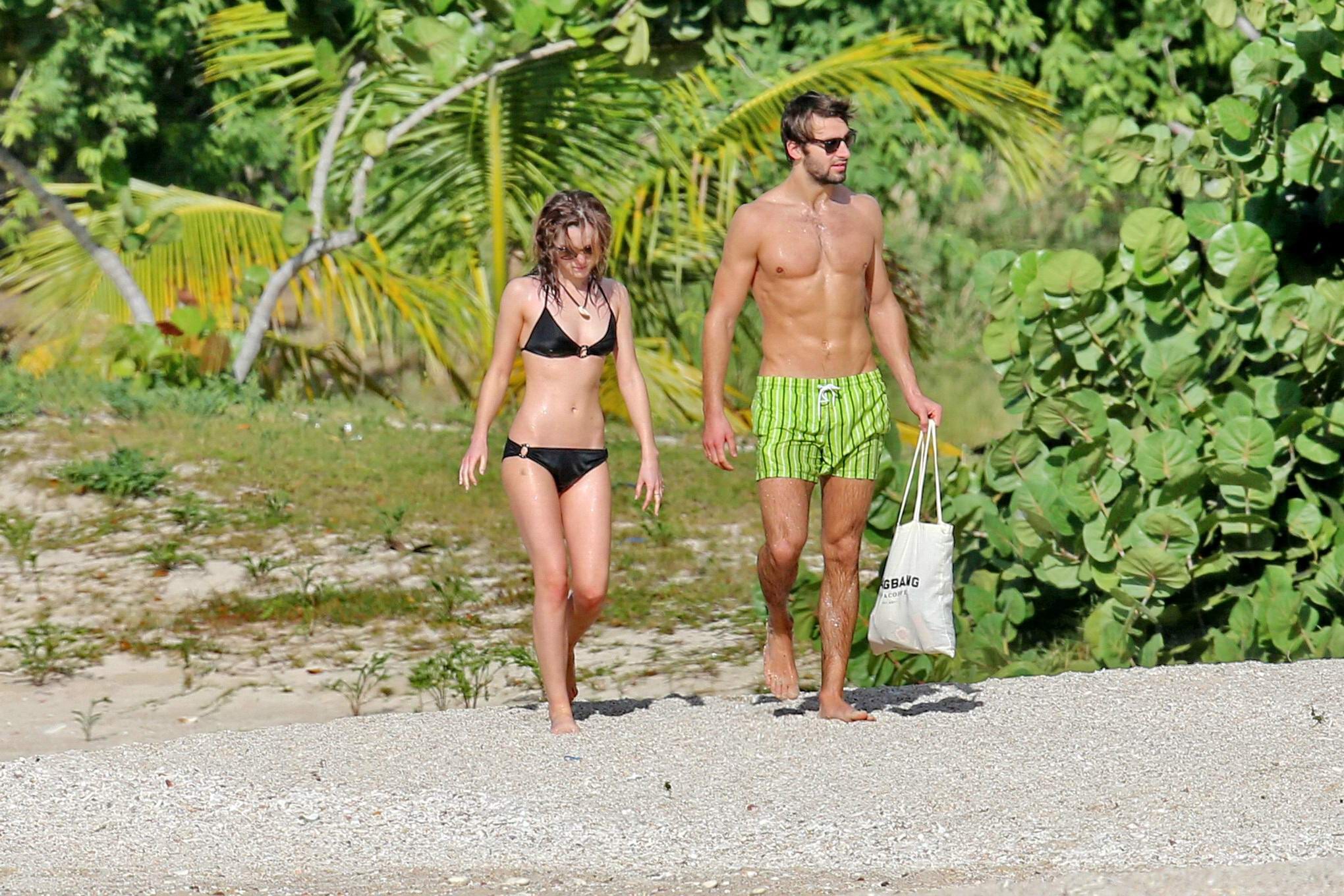 Emma Watson in black bikini petting with her boyfriend on a Carribean beach #75207844