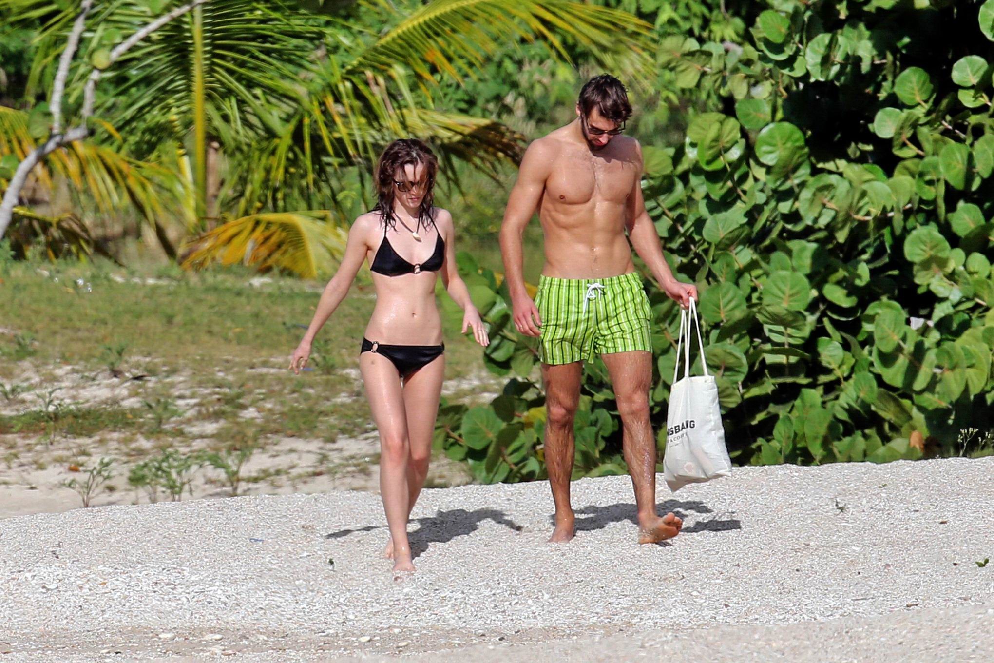 Emma Watson in black bikini petting with her boyfriend on a Carribean beach #75207850