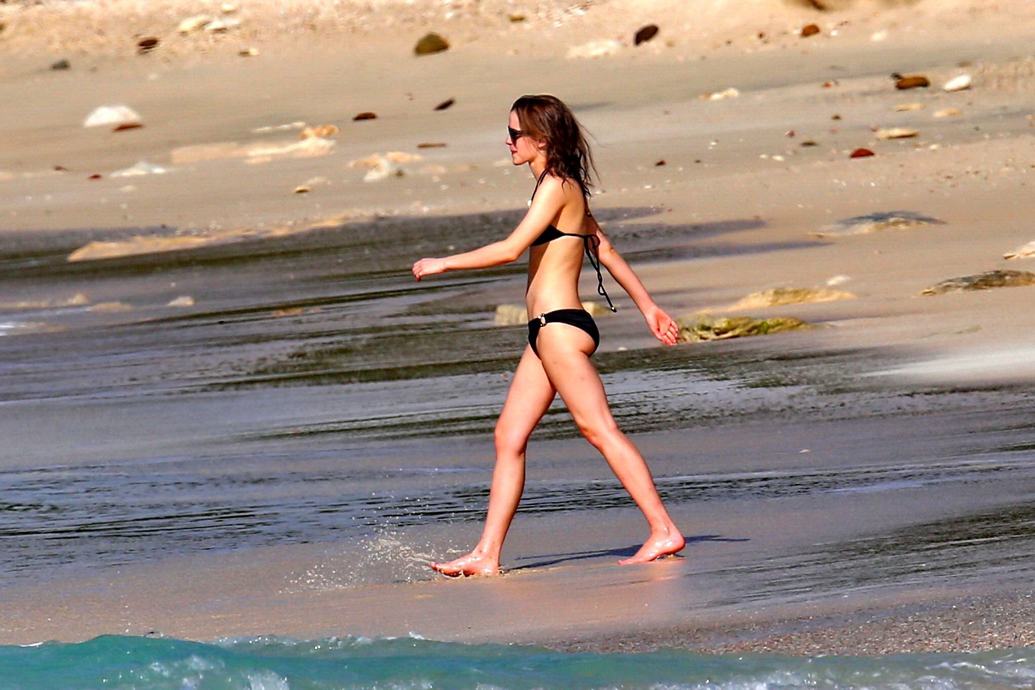 Emma Watson in black bikini petting with her boyfriend on a Carribean beach #75207902