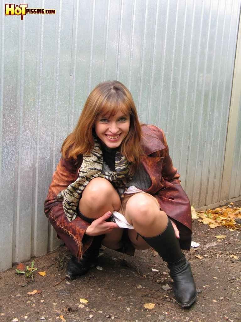 Hot redhead pissing outdoors in the winter #76592289