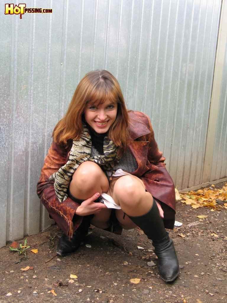 Hot redhead pissing outdoors in the winter #76592293