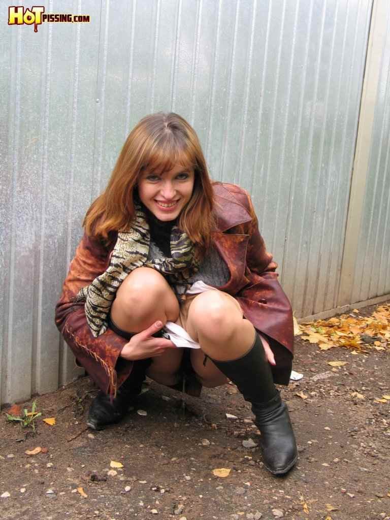 Hot redhead pissing outdoors in the winter #76592298