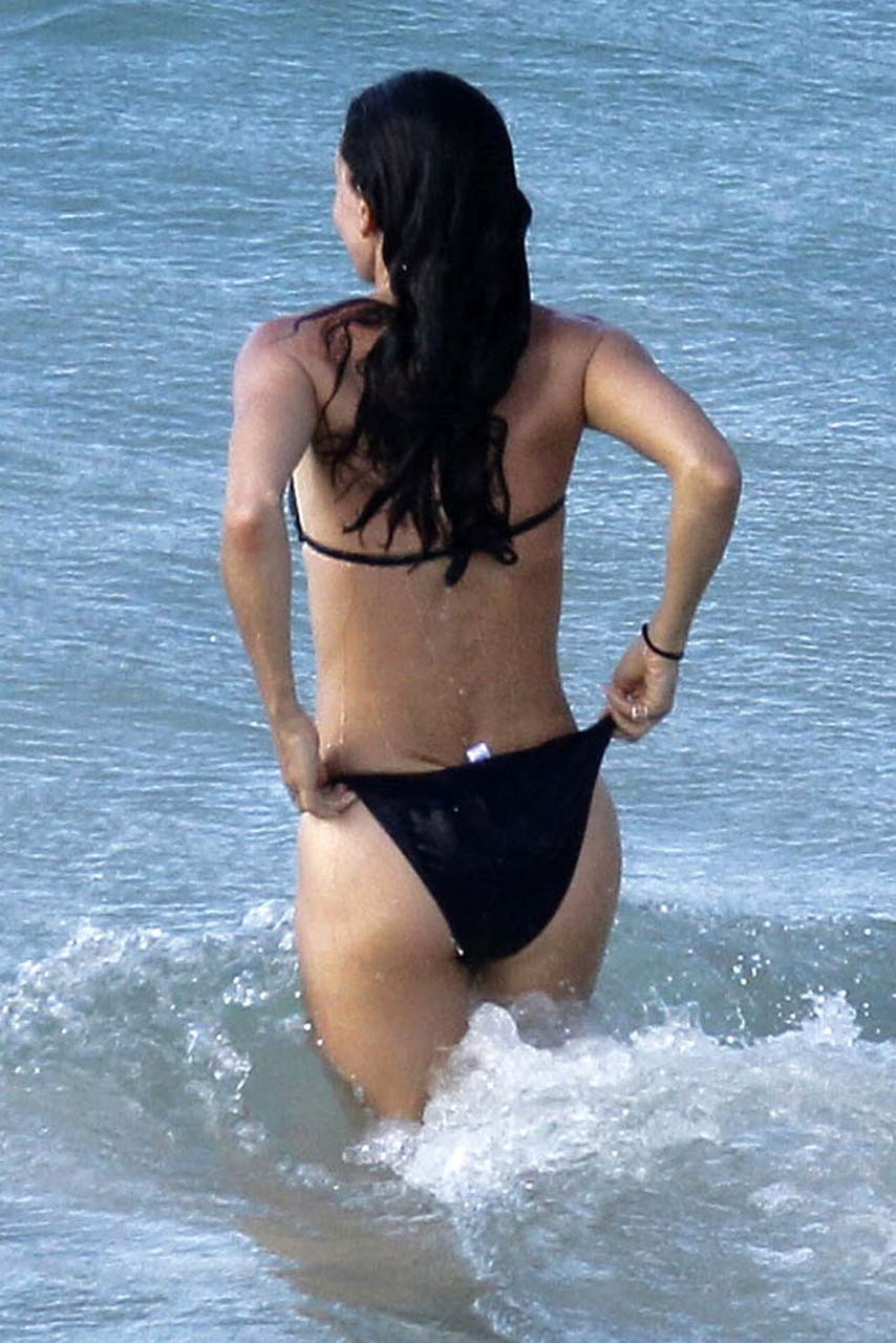 Courteney Cox nipple slip and looking very sexy in black bikini on beach paparaz #75309899