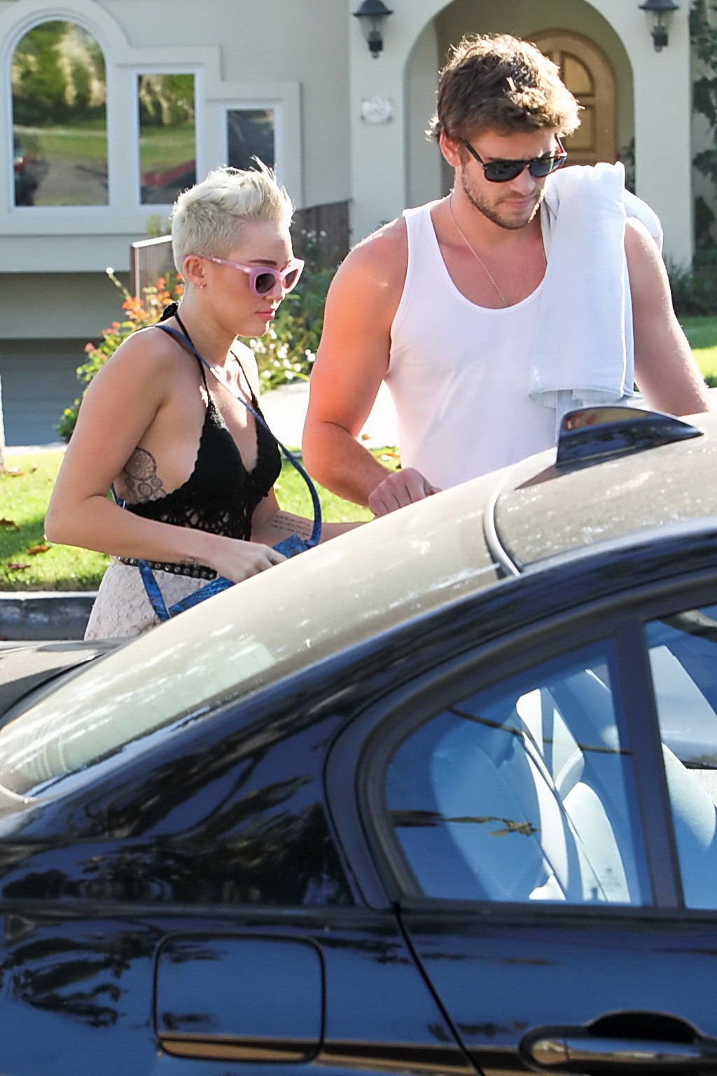 Miley Cyrus braless showing side boob in a partially see-through tiny top and sh #75251474