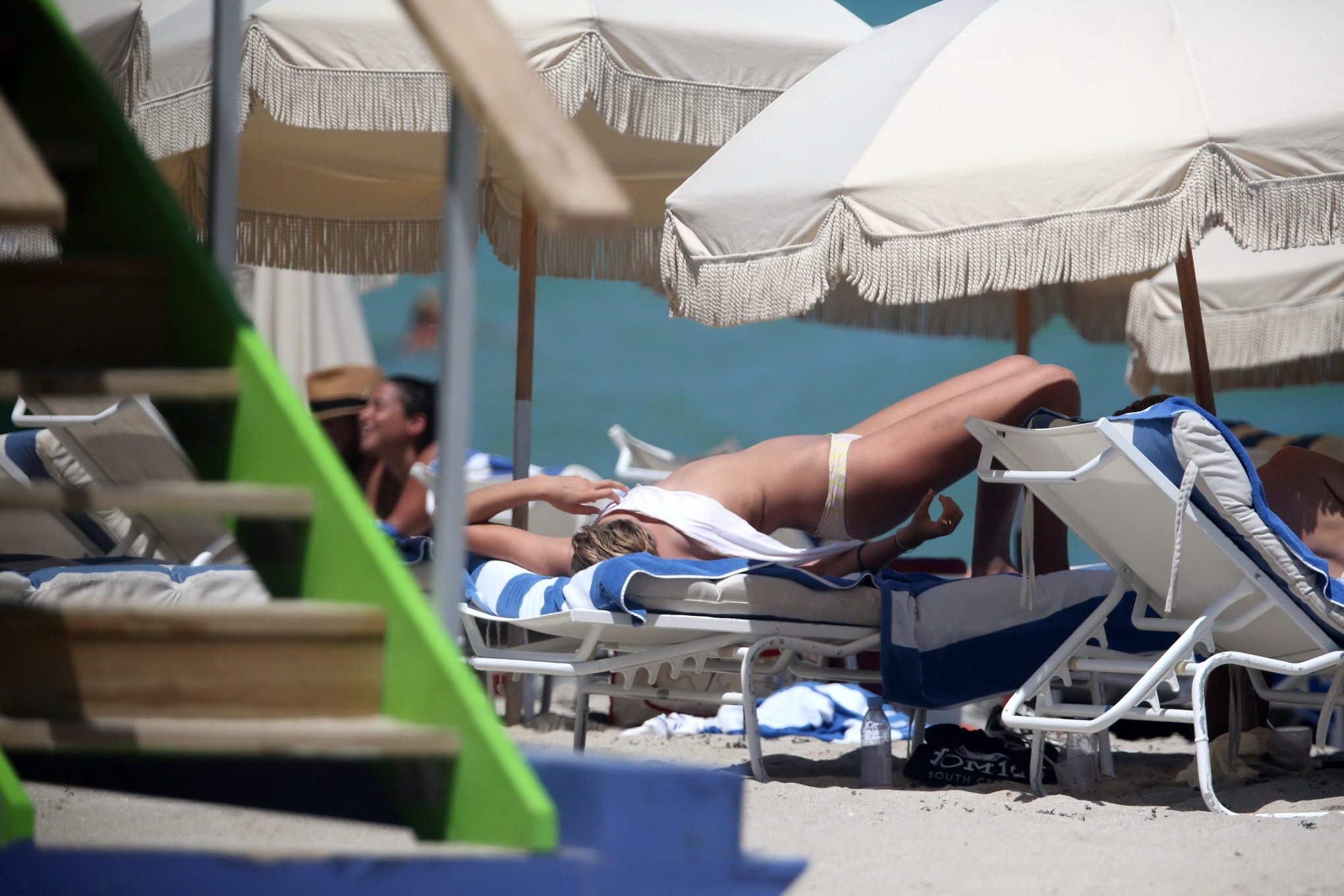 Toni Garrn topless tanning her back #75153011