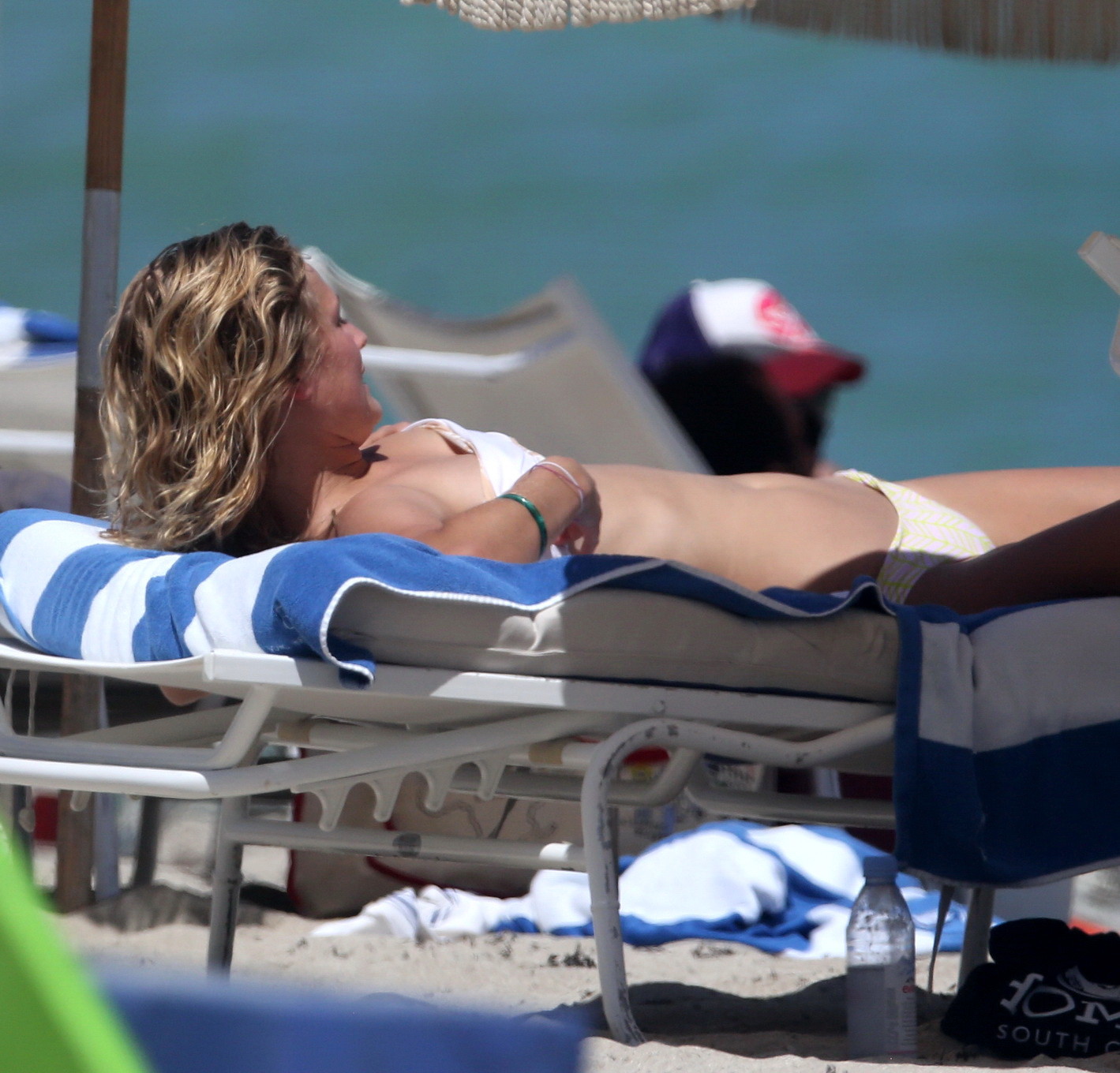 Toni Garrn topless tanning her back #75153015