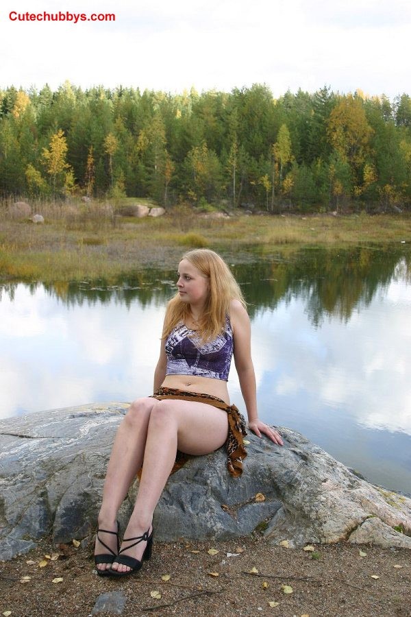 Cute chubby girl posing outdoors #75579112