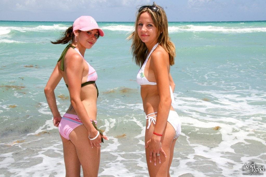 Two bikin beach girls playing #72314946