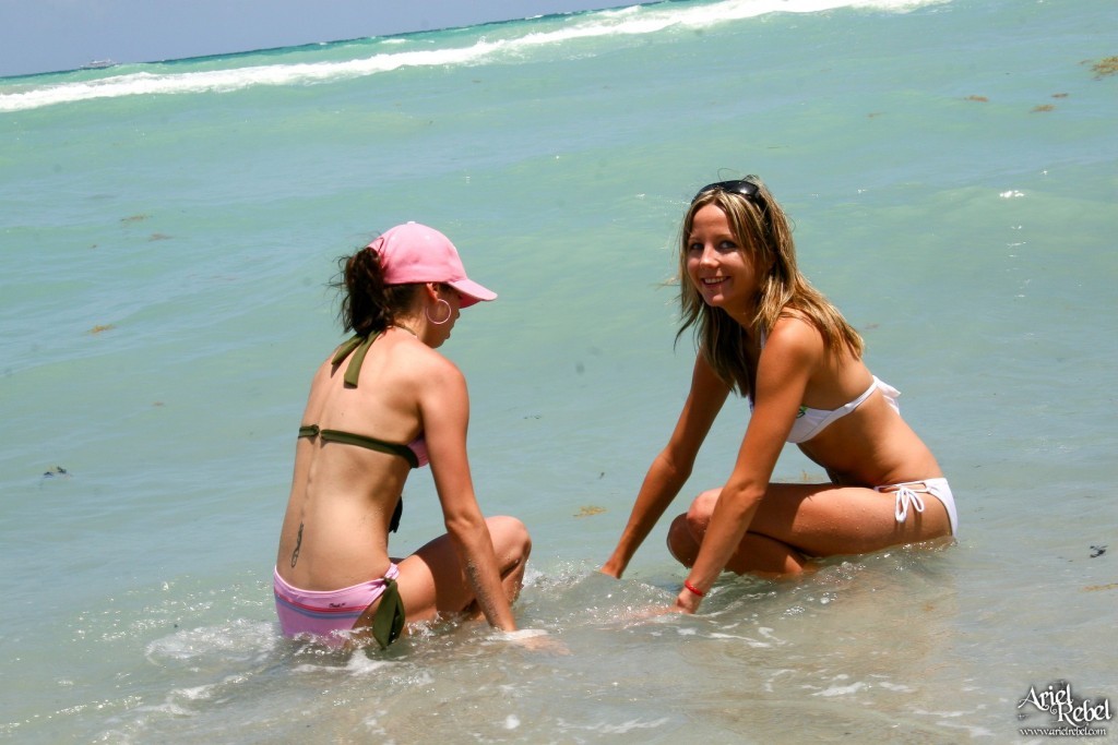 Two bikin beach girls playing #72314985