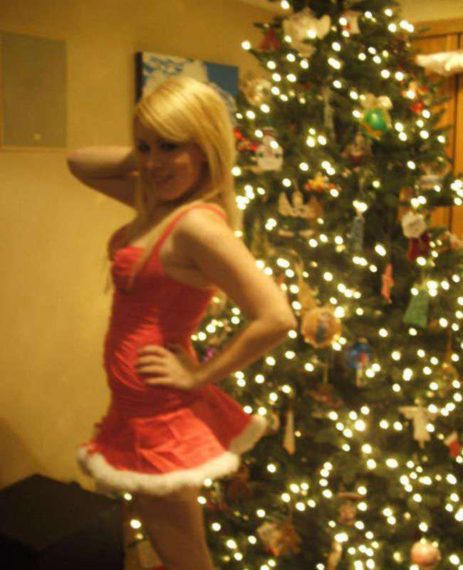 Pictures of a cutie posing by the Christmas tree #75719858