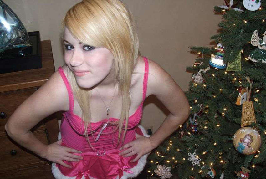 Pictures of a cutie posing by the Christmas tree #75719869