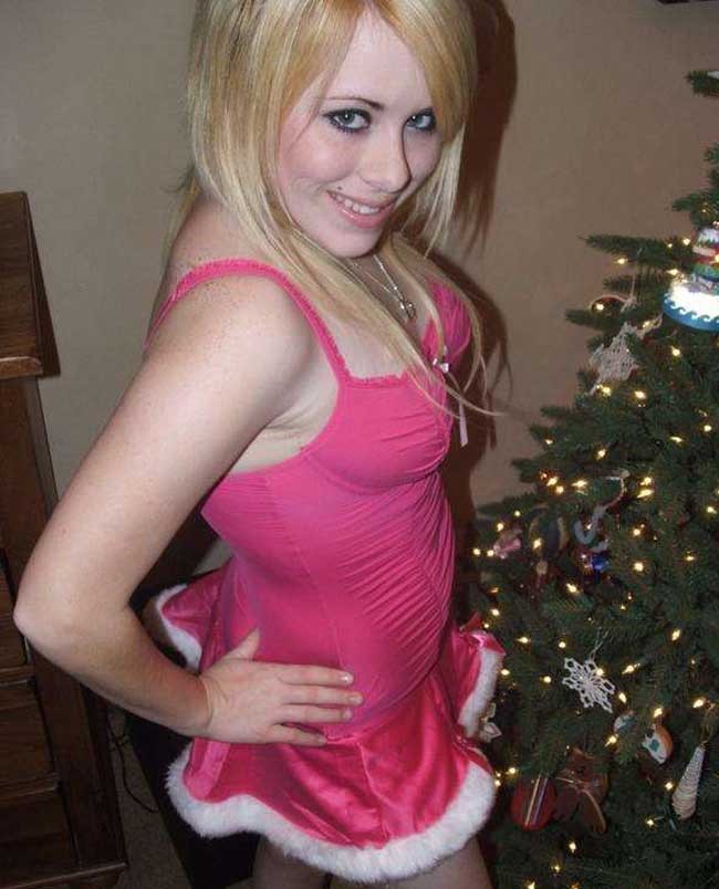 Pictures of a cutie posing by the Christmas tree #75719906
