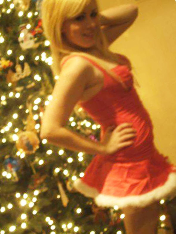 Pictures of a cutie posing by the Christmas tree #75719956