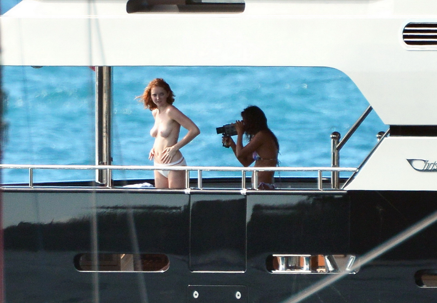 Busty Lily Cole diving topless from a yacht in St. Barts #75244490