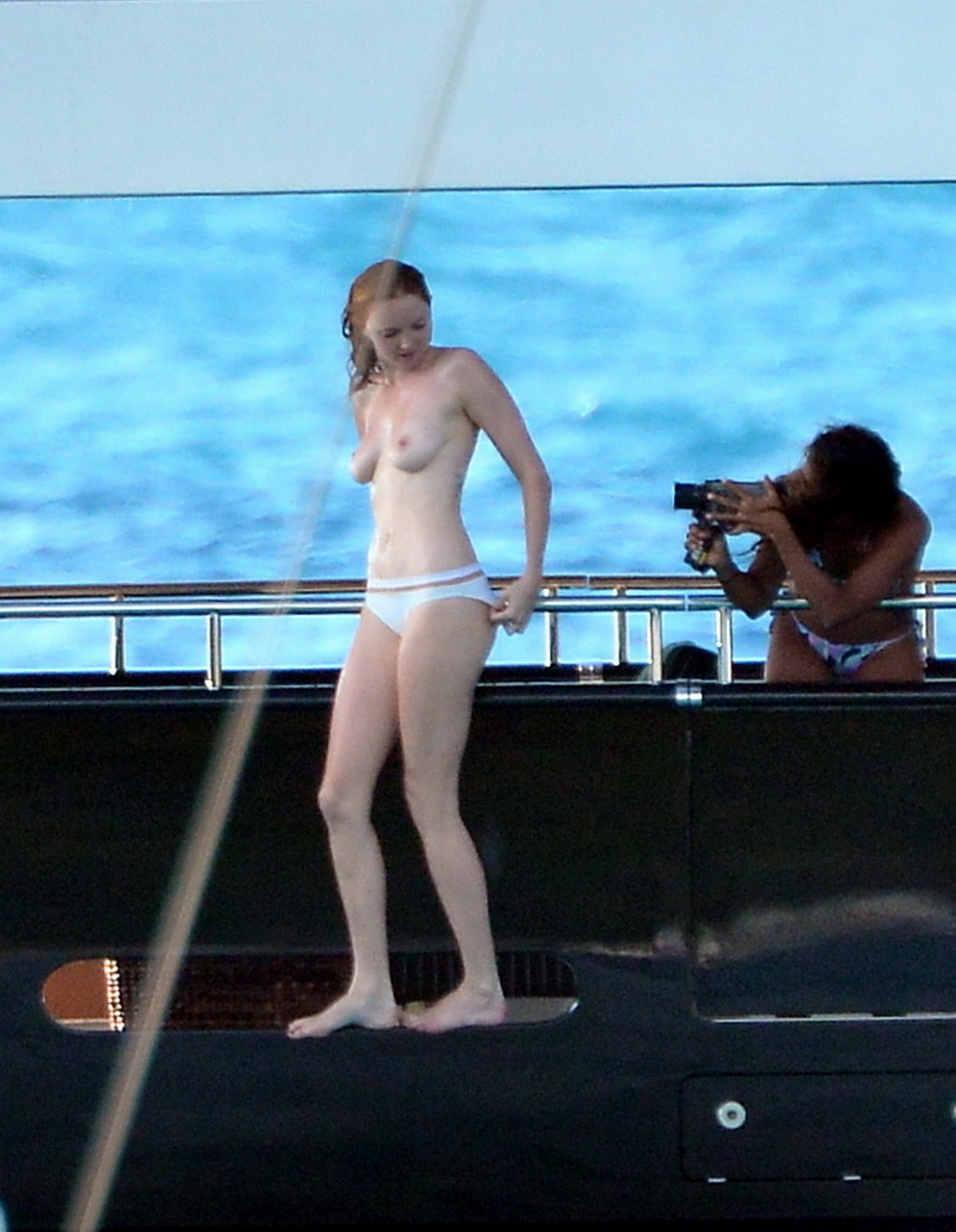 Busty Lily Cole diving topless from a yacht in St. Barts #75244514