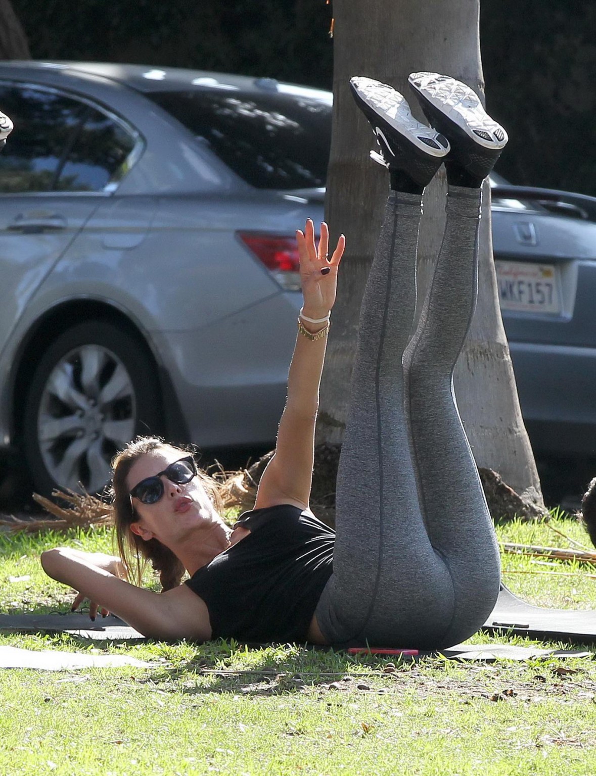 Alessandra Ambrosio shows off her ass in tights while working out at a park in S #75178946