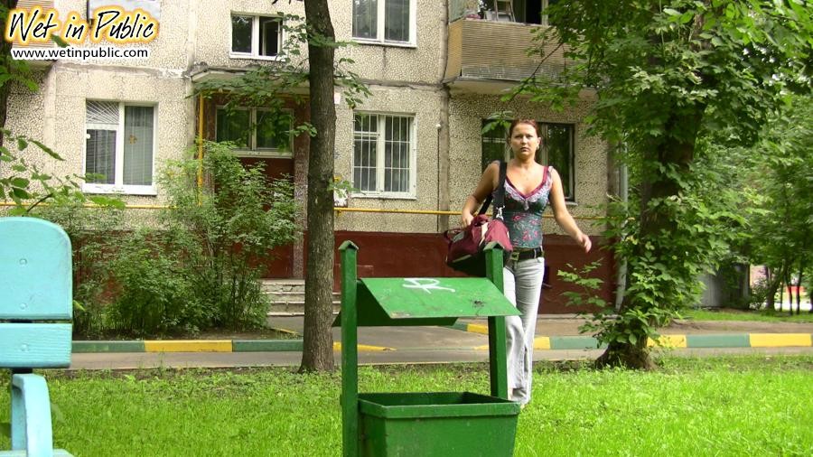 Fleshy gal shamefully empties her bladder in the gray jeans on a bench #78595154