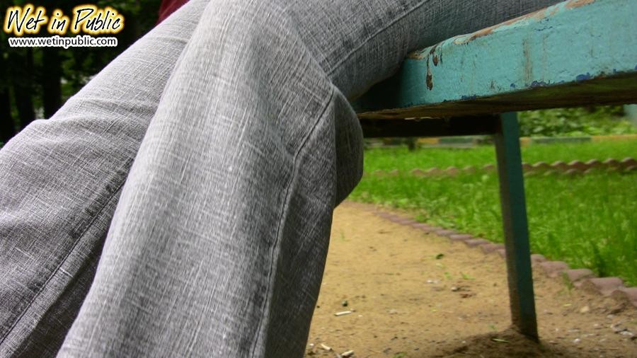 Fleshy gal shamefully empties her bladder in the gray jeans on a bench #78595177