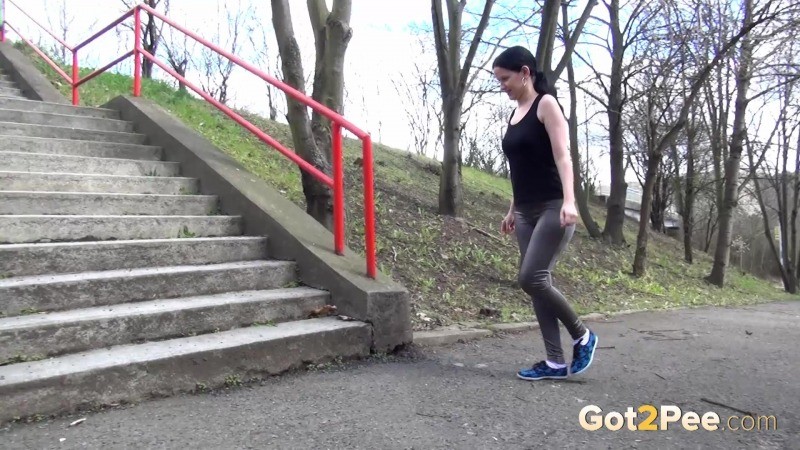 Dark haired girl pisses on concrete steps #67499706